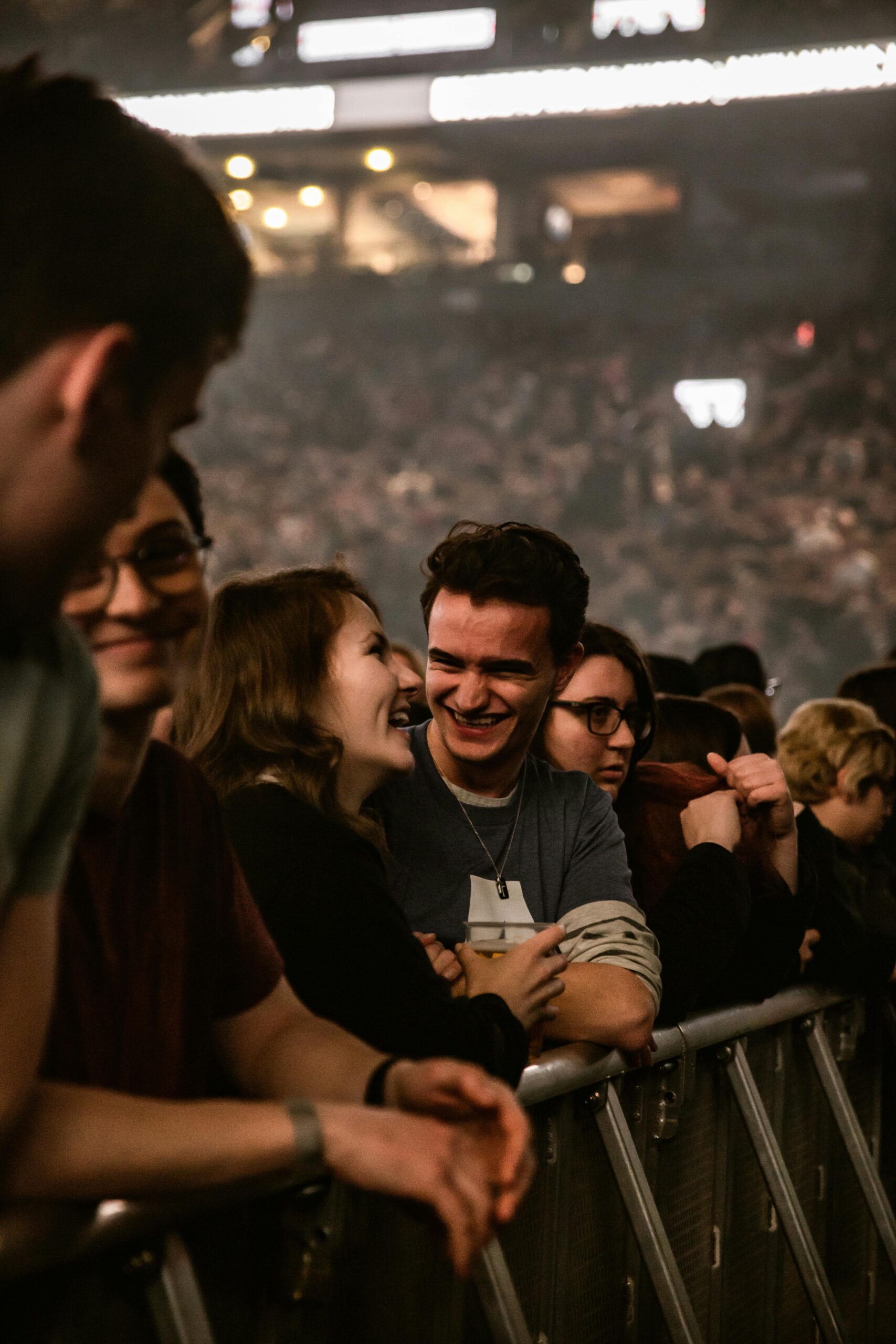 pexels-photo-1916817-1916817 A lively crowd at a concert enjoying the performance with smiles and laughter.